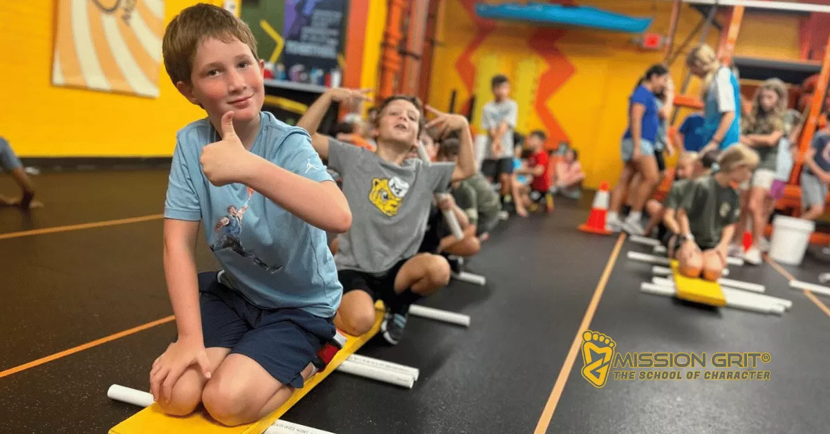 Kids participating in a balance and coordination challenge during one of Mission Grit's spring camps in Charlotte NC.