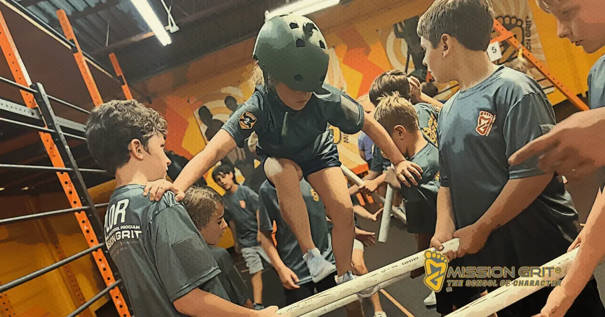 Kids working together to balance across an obstacle during a Mission Grit leadership and teamwork activity.